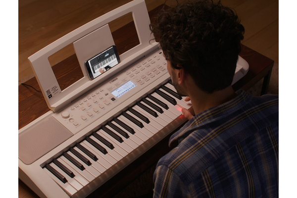 Father trying Auto Chord Play alone at night.