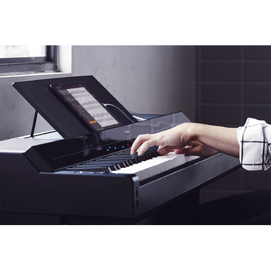 A Yamaha P-S500 and a smart device displaying a music score using the Smart Pianist app
